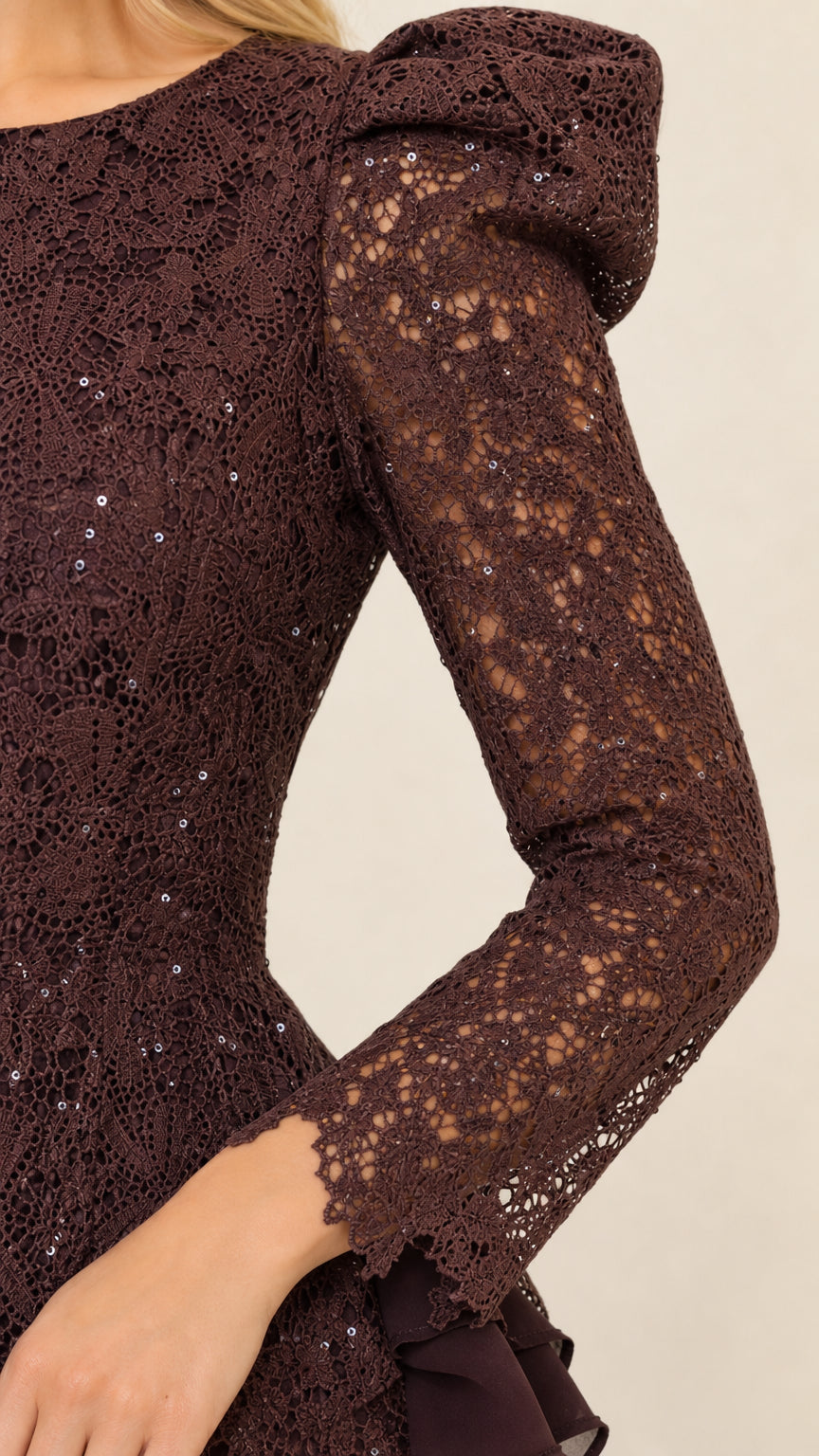 Close-up of sleeve and shoulder detail on dark brown lace dress
