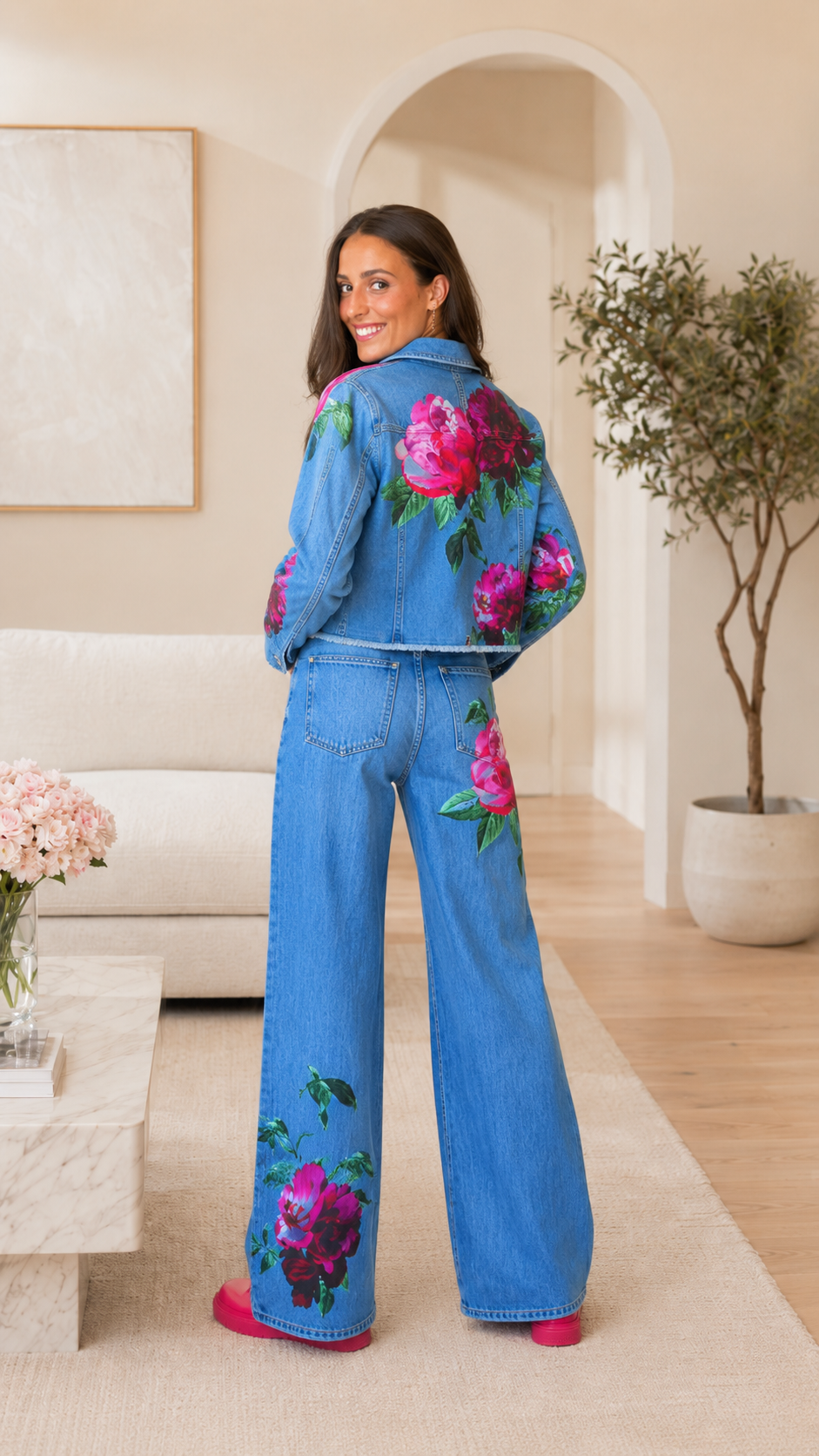 Back view of light blue floral print denim jacket and wide leg jeans set