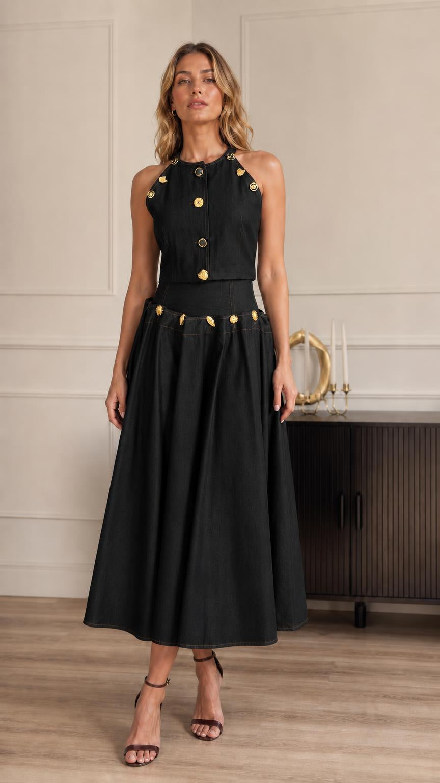 Full-length view of model in black two-piece set