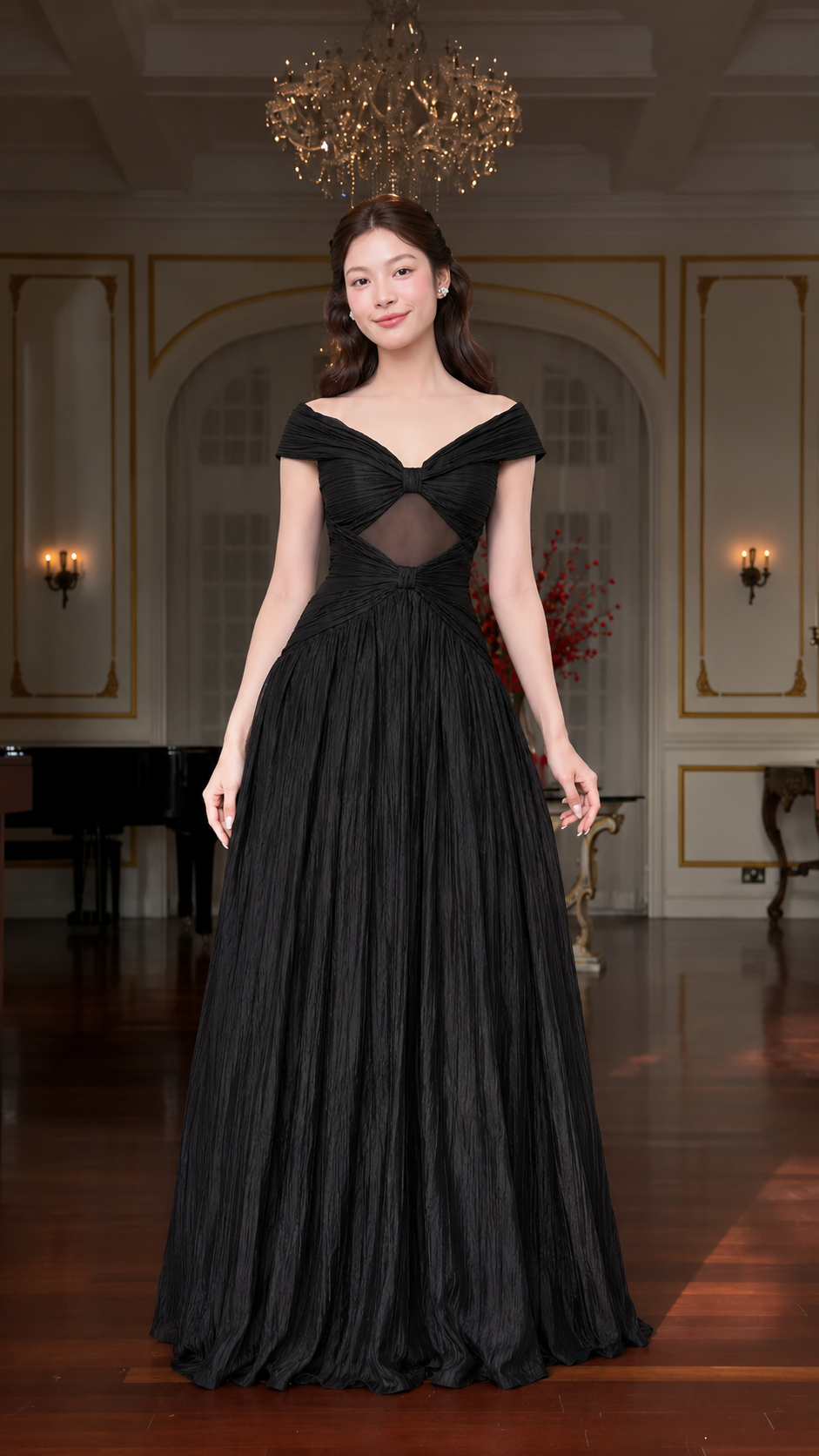Front view of black off-shoulder formal gown with mesh cutout and pleated maxi skirt