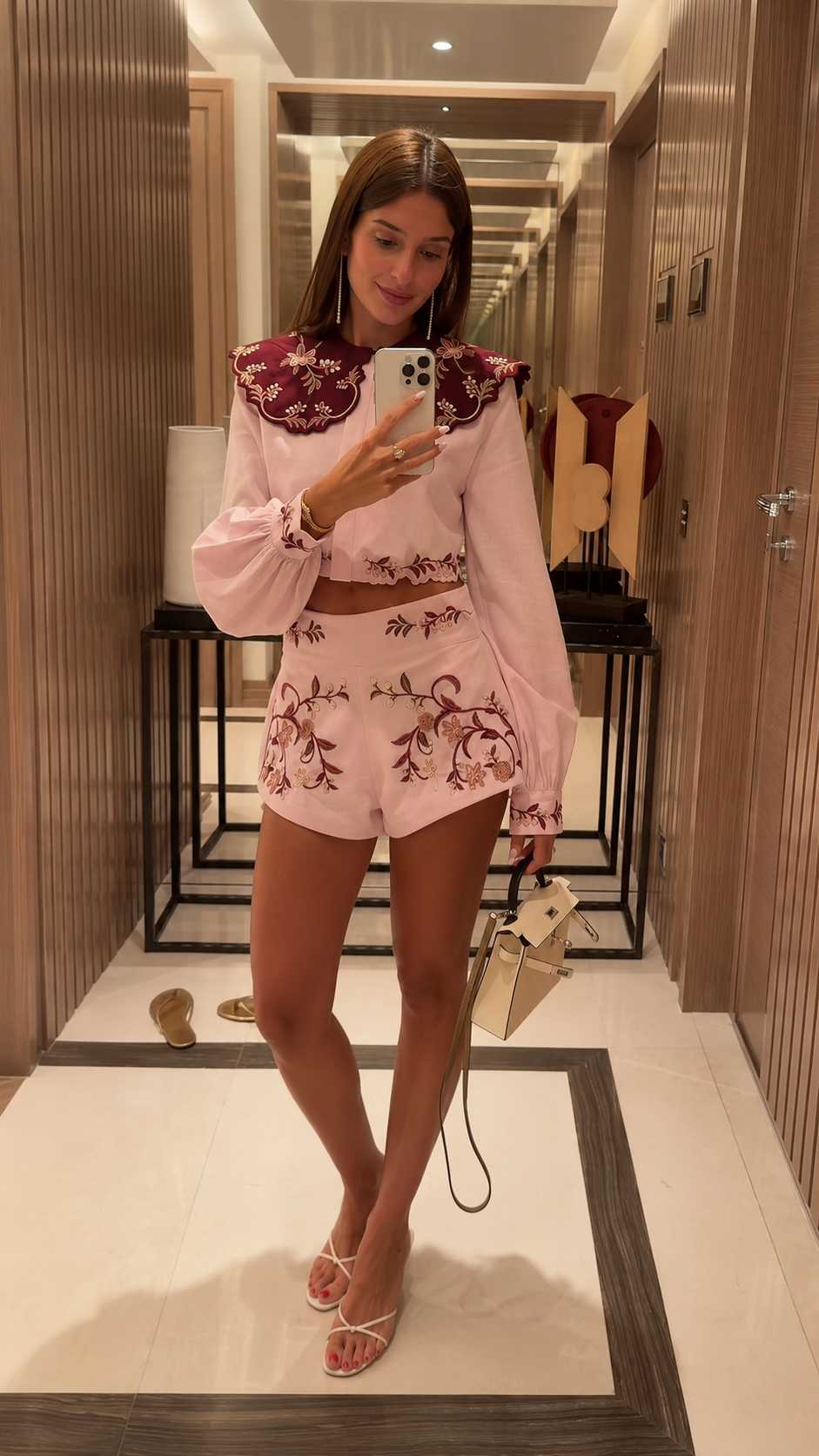 Front view of blush pink embroidered crop blouse and shorts set with contrast collar