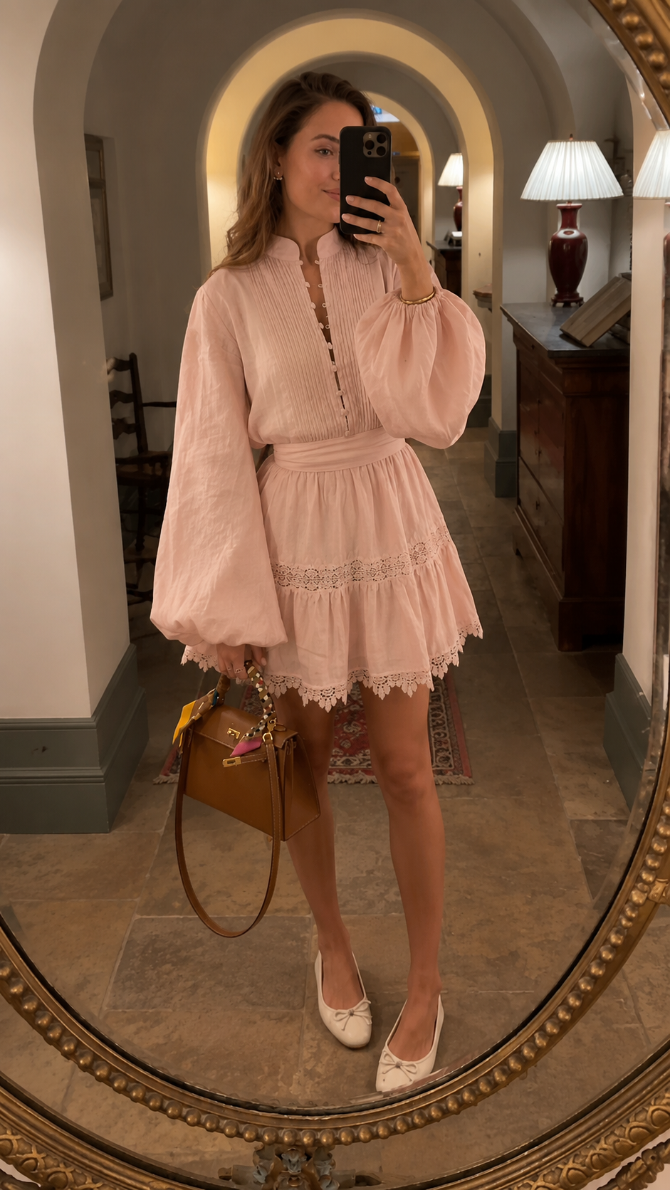 Blush pink boho mini dress with long puff sleeves and lace-trimmed hem