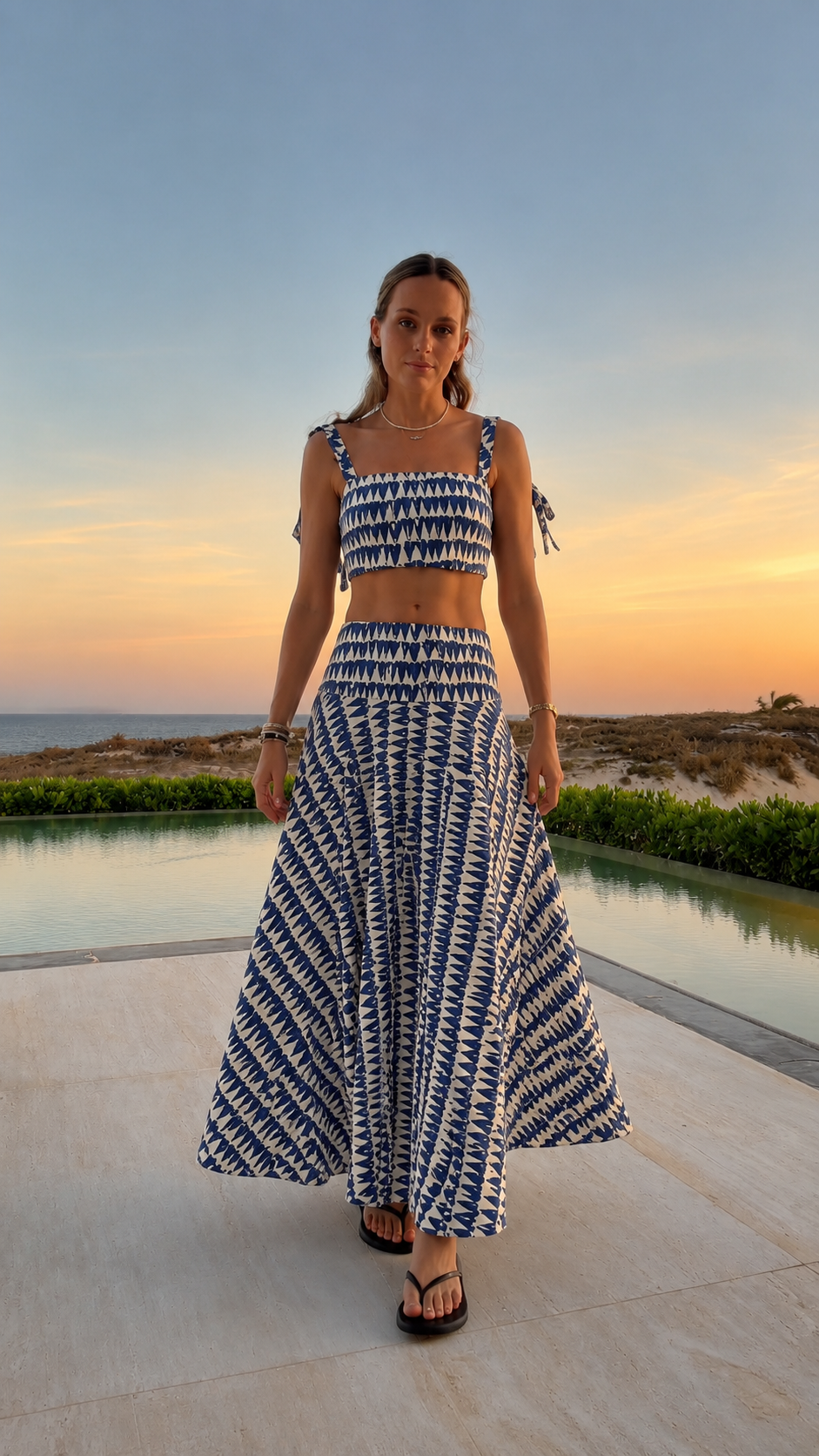 Front view of blue printed smocked crop top and maxi skirt set