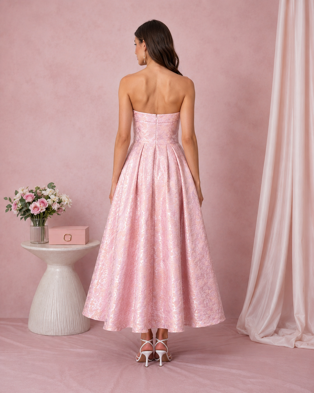 Back view of blush pink strapless jacquard midi dress