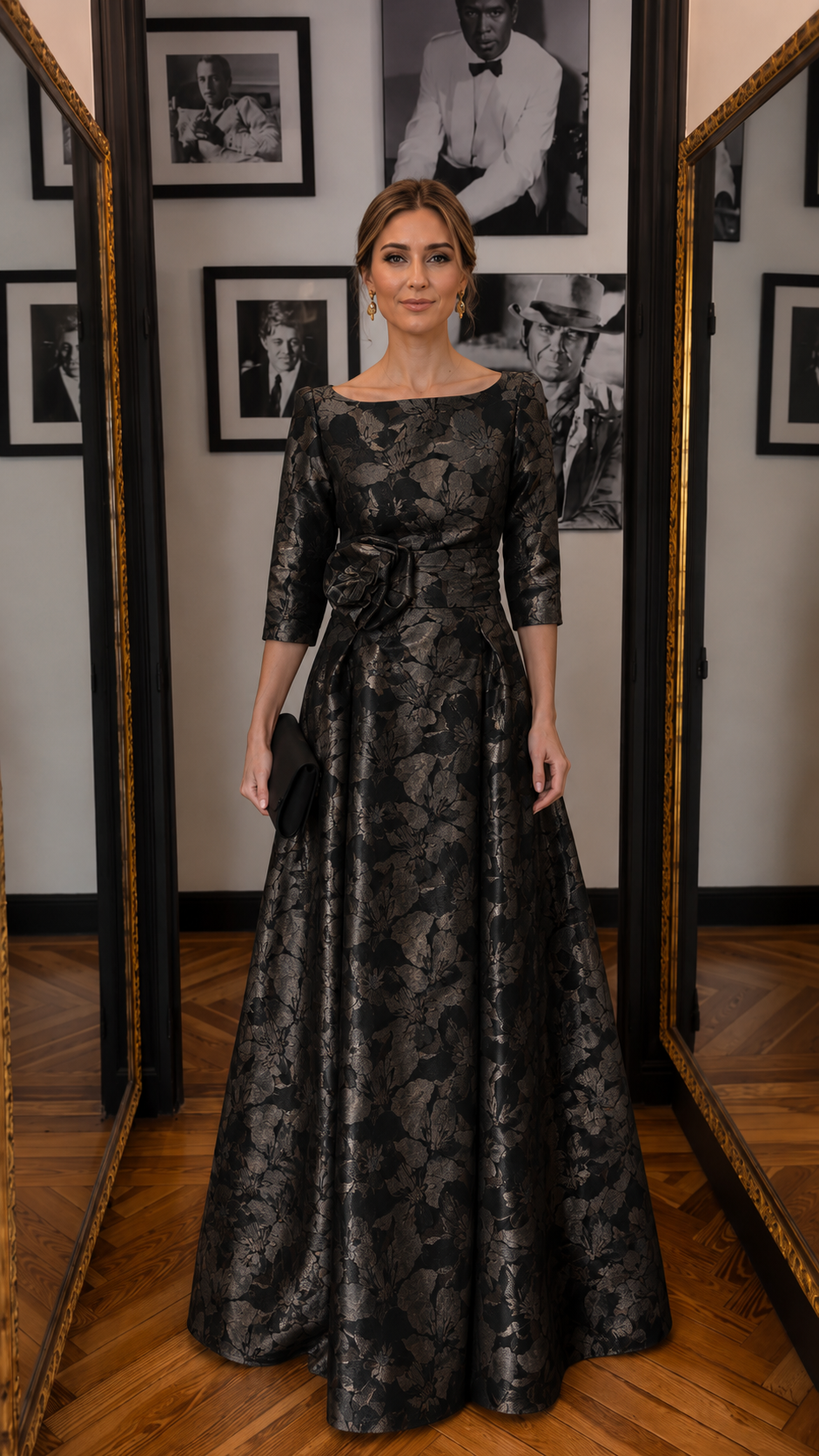 Front view of black floral jacquard floor-length formal gown with 3/4 sleeves and waist rosette