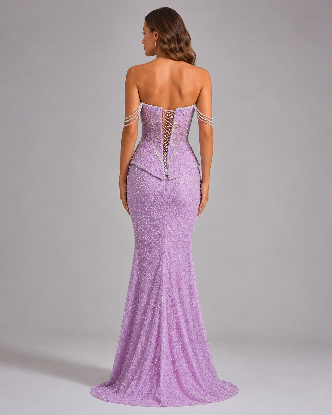 Back view of lilac mermaid evening gown with lace-up corset detail