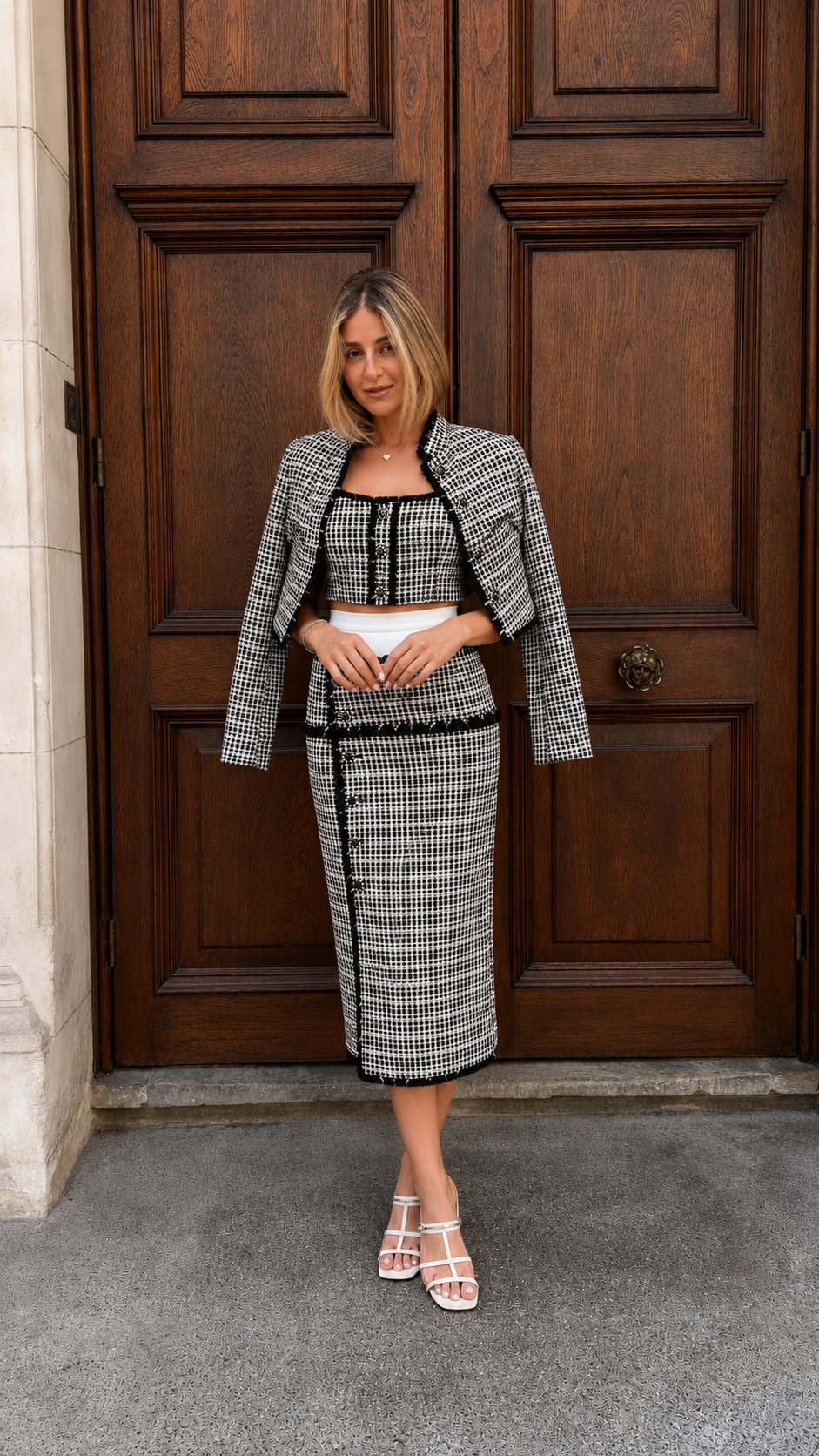 Front view of black tweed-look three-piece skirt set with contrast trim and fitted midi skirt