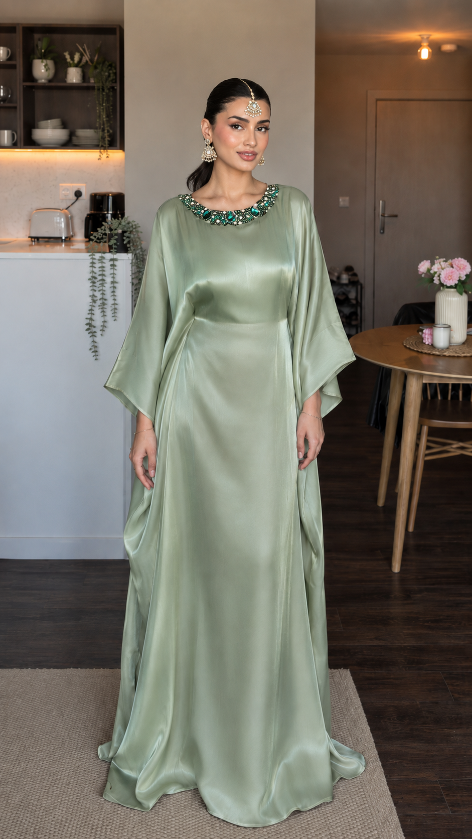 Front view of sage satin-look maxi dress with draped sleeves and embellished neckline