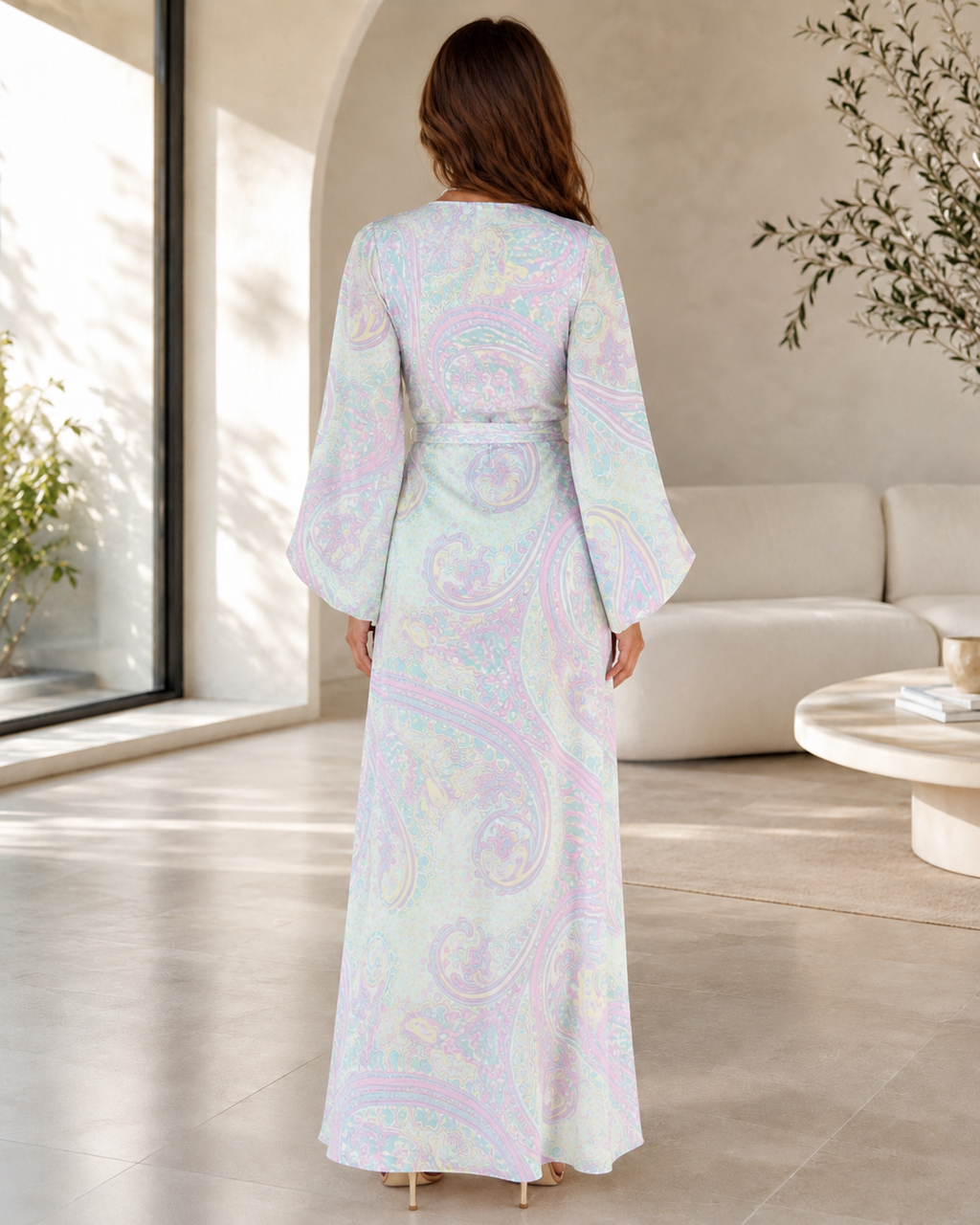 Back view of pastel printed maxi dress with long sleeves and full-length flowing silhouette