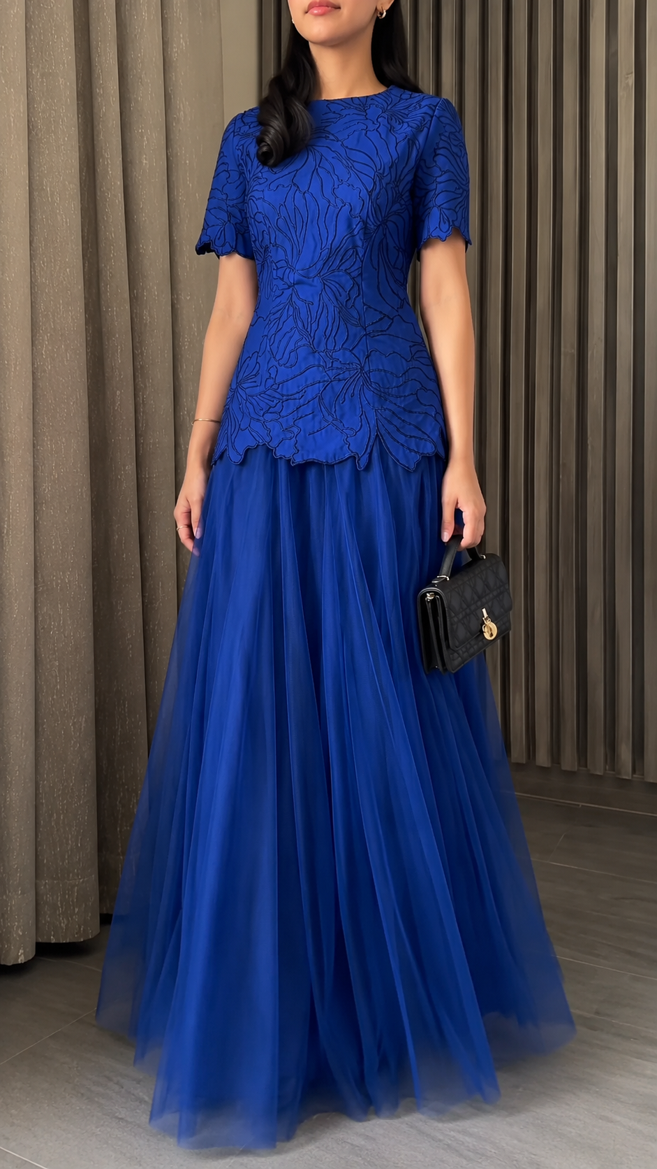 Front view of royal blue floral bodice formal dress with full tulle skirt