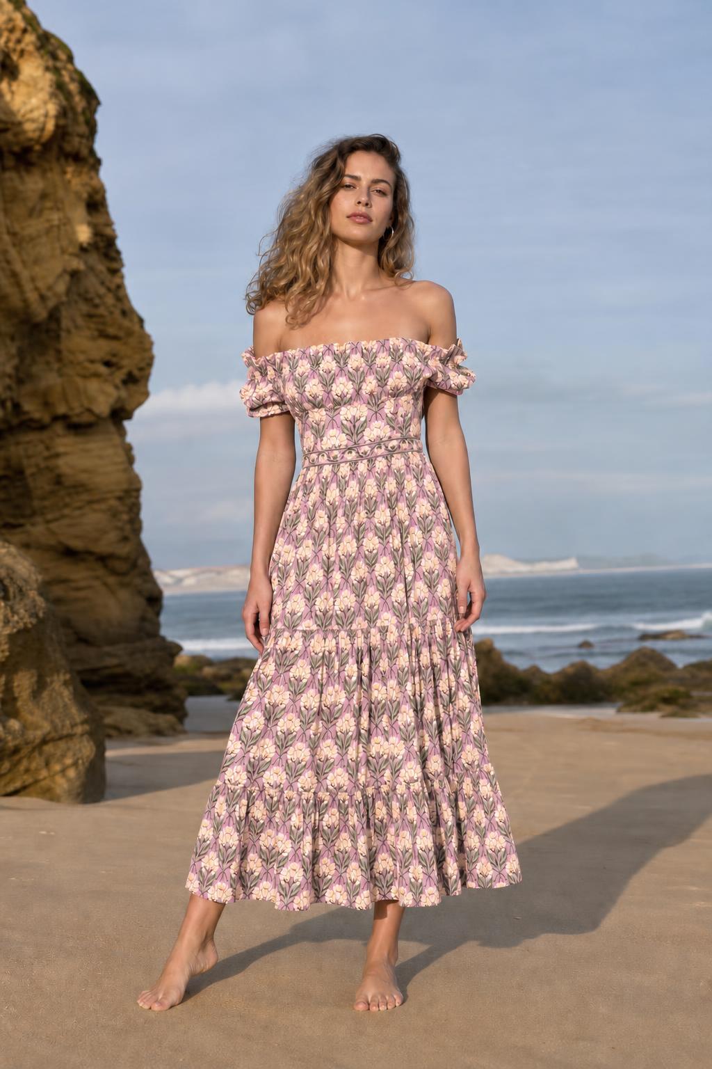 Woman wearing pink floral off-the-shoulder midi dress