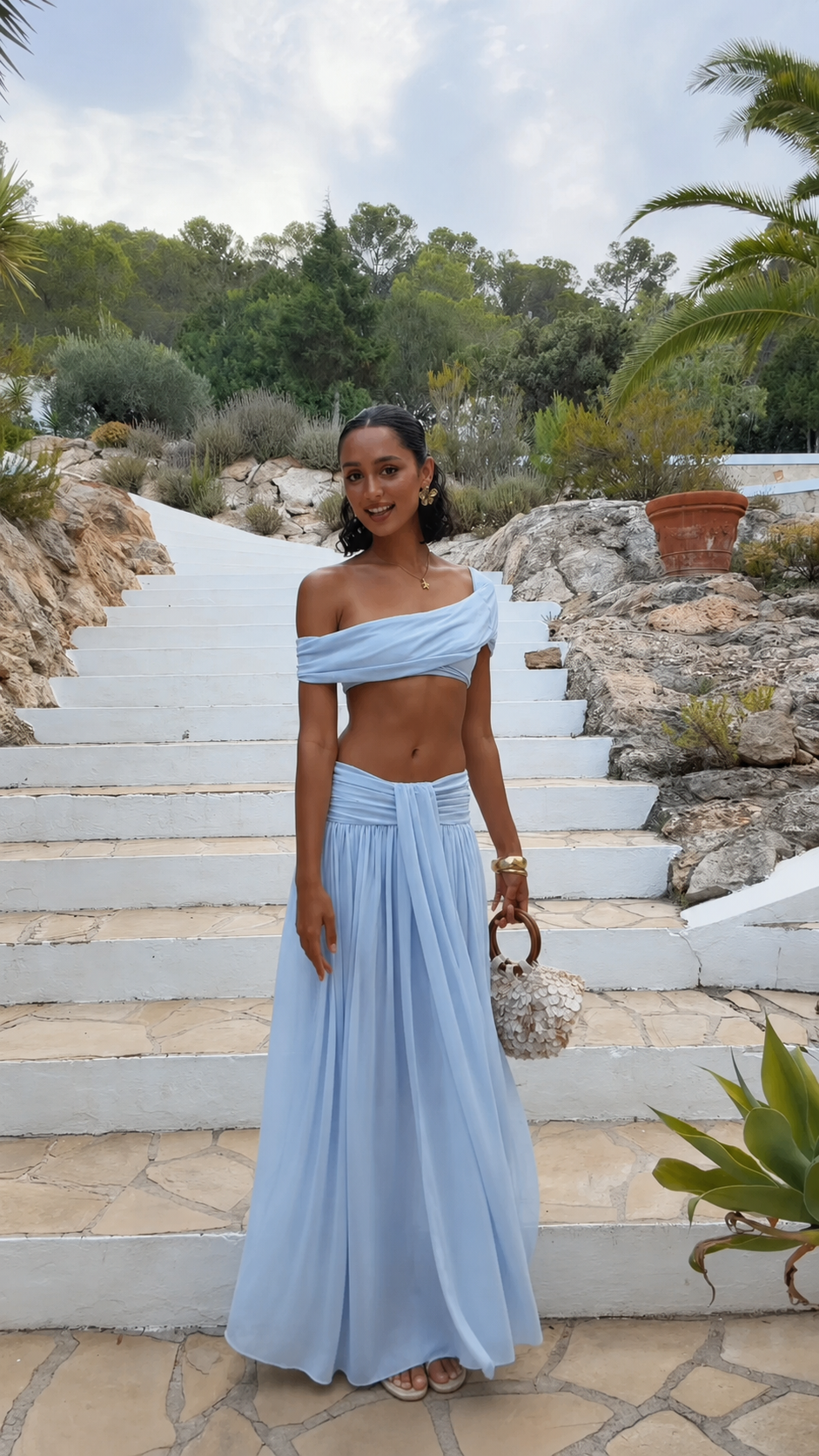 Powder blue off-shoulder two piece maxi skirt set with full-length draped skirt