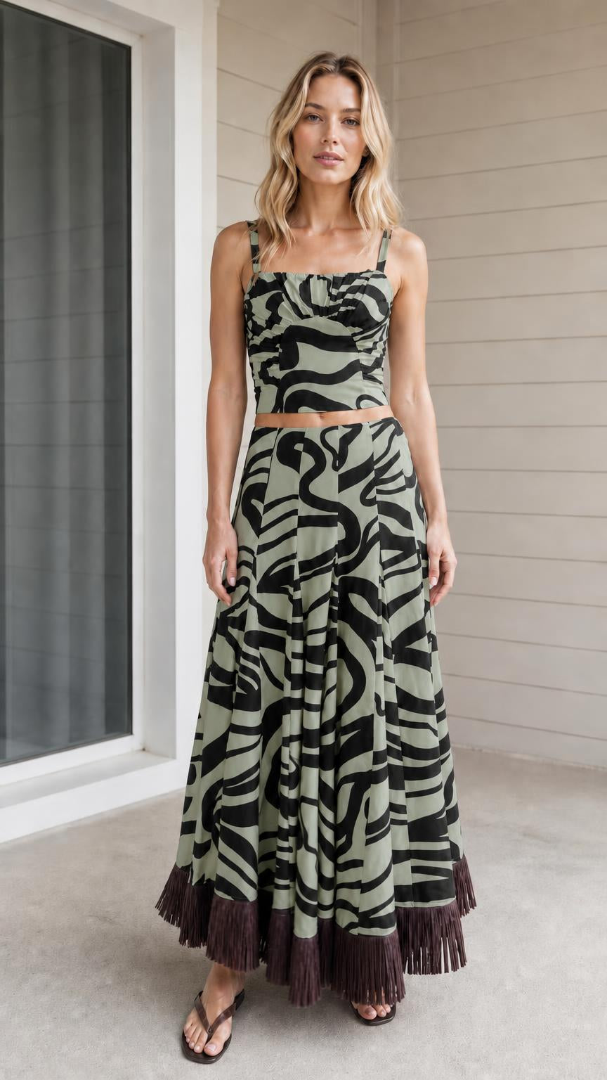 Model wearing sage green zebra print crop top and maxi skirt set