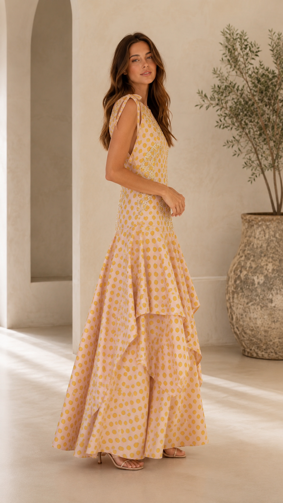 Side view of blush yellow embroidered polka dot tiered maxi dress