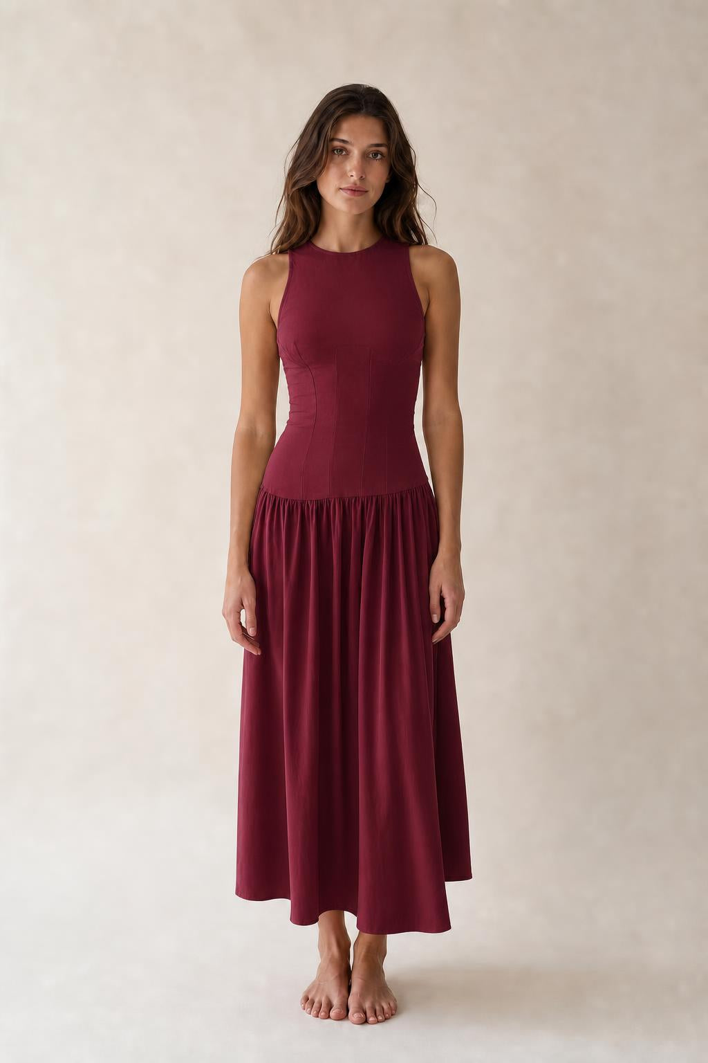 Front view of woman wearing Burgundy sleeveless midi dress