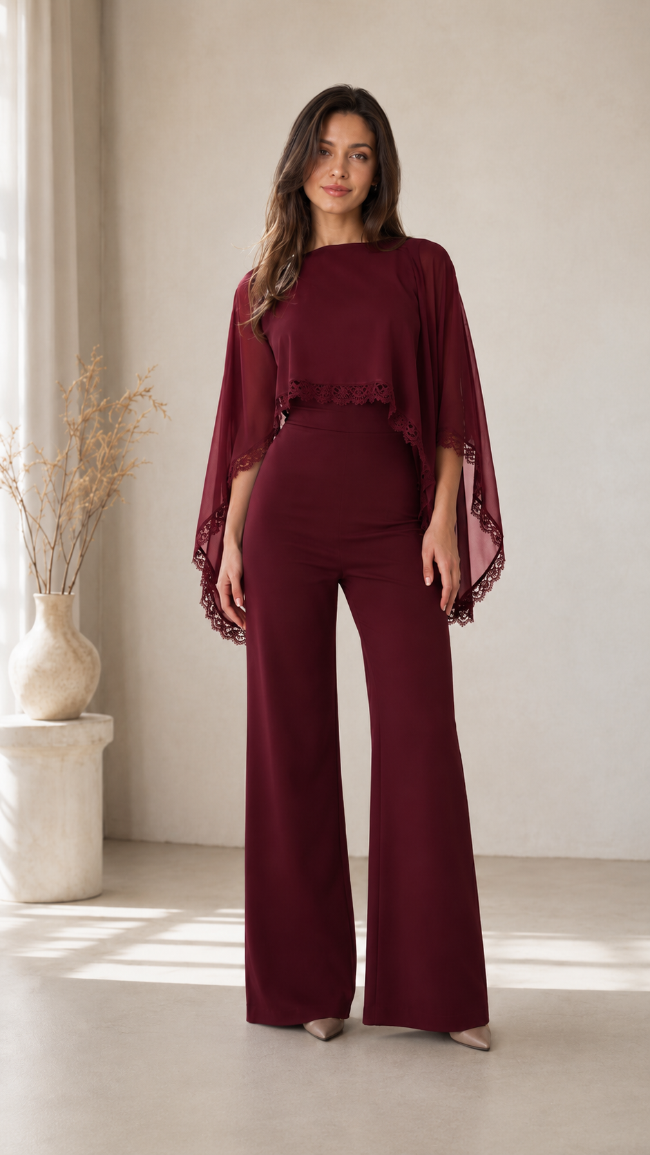 Front view of burgundy cape sleeve wide leg jumpsuit