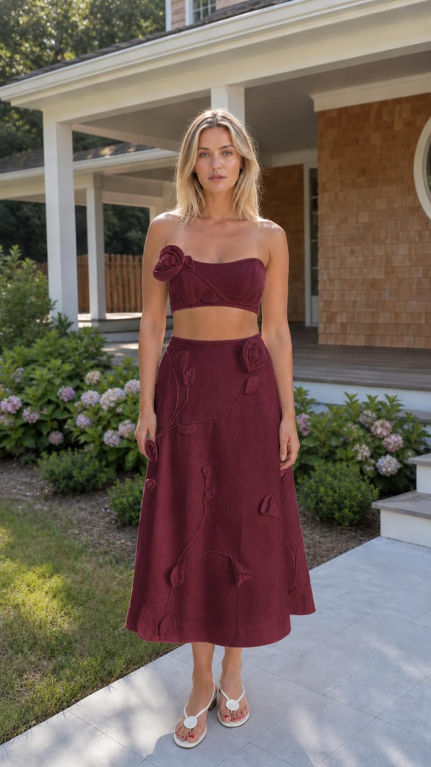 Front view of woman wearing burgundy floral applique two-piece set