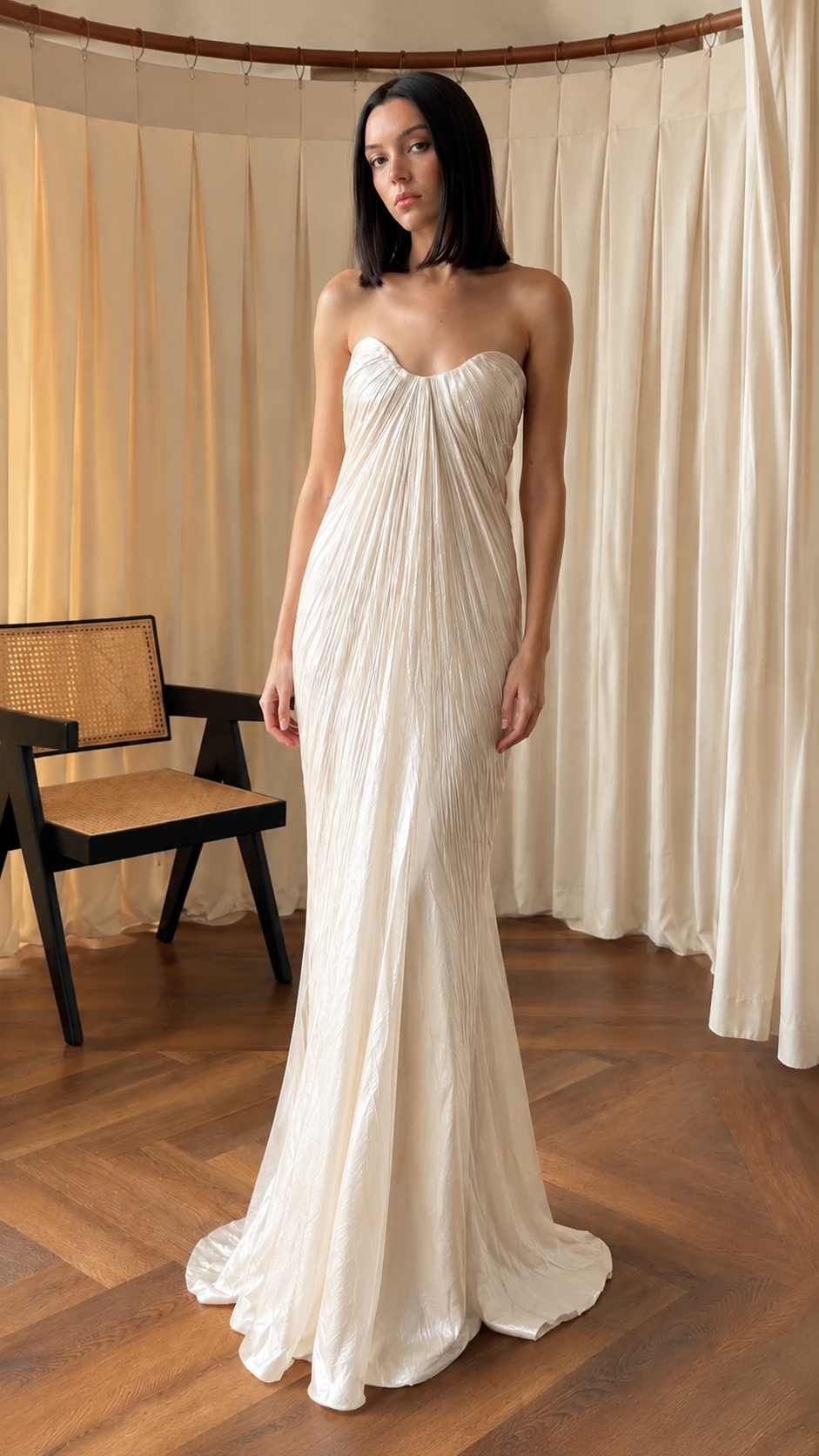 Front view of ivory strapless pleated maxi evening dress
