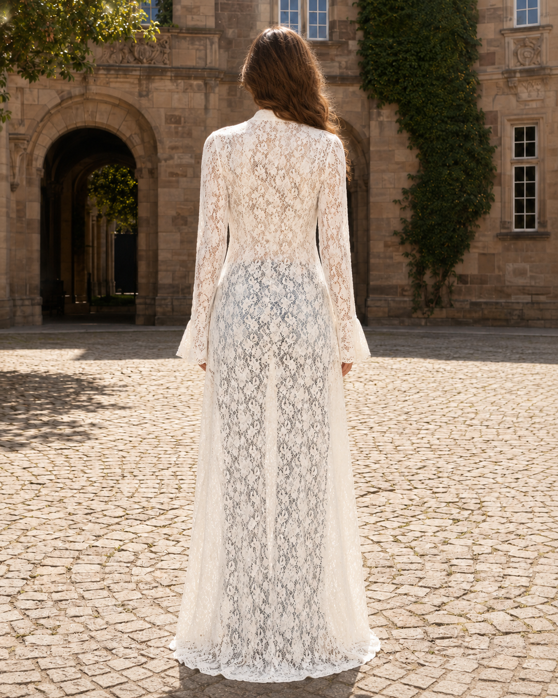 Back view of white sheer lace maxi cardigan showing full-length floral lace pattern