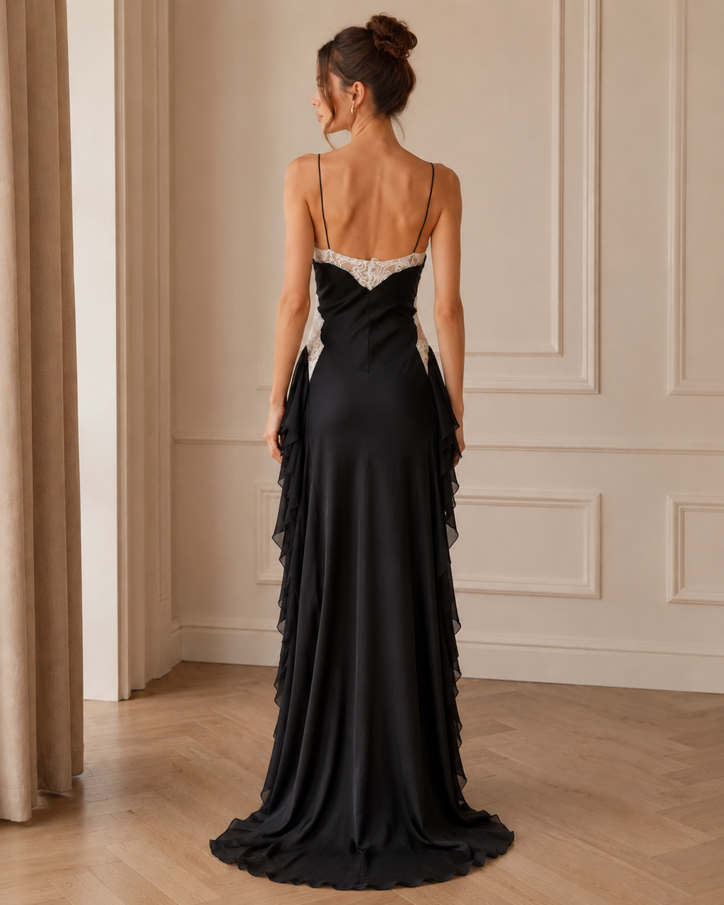 Back view of black slip maxi dress with lace back neckline and slim shoulder straps