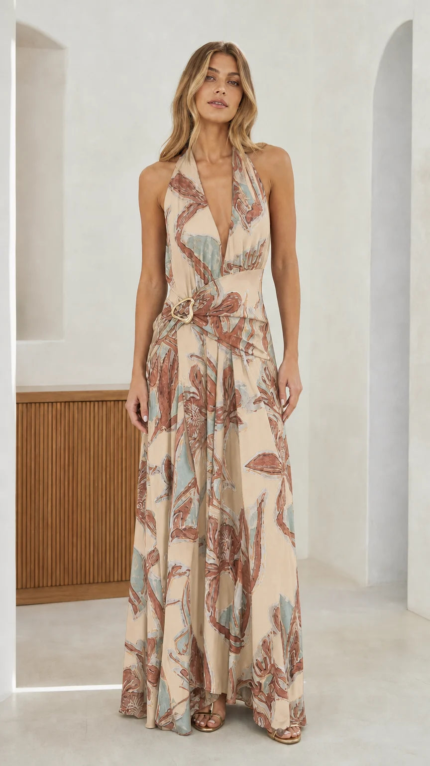 Front view of beige abstract print halter maxi dress