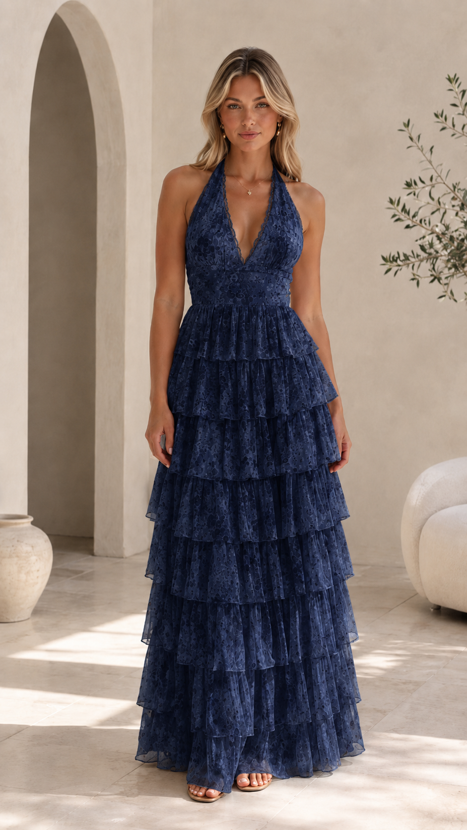Front view of navy tiered halter maxi dress