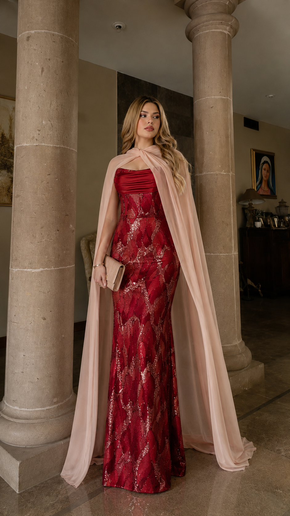 Wine red sequined evening gown with blush-toned cape and fitted shape