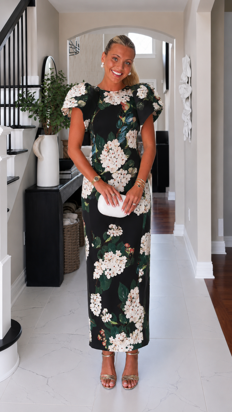 Front view of black floral maxi dress with ruffle sleeves