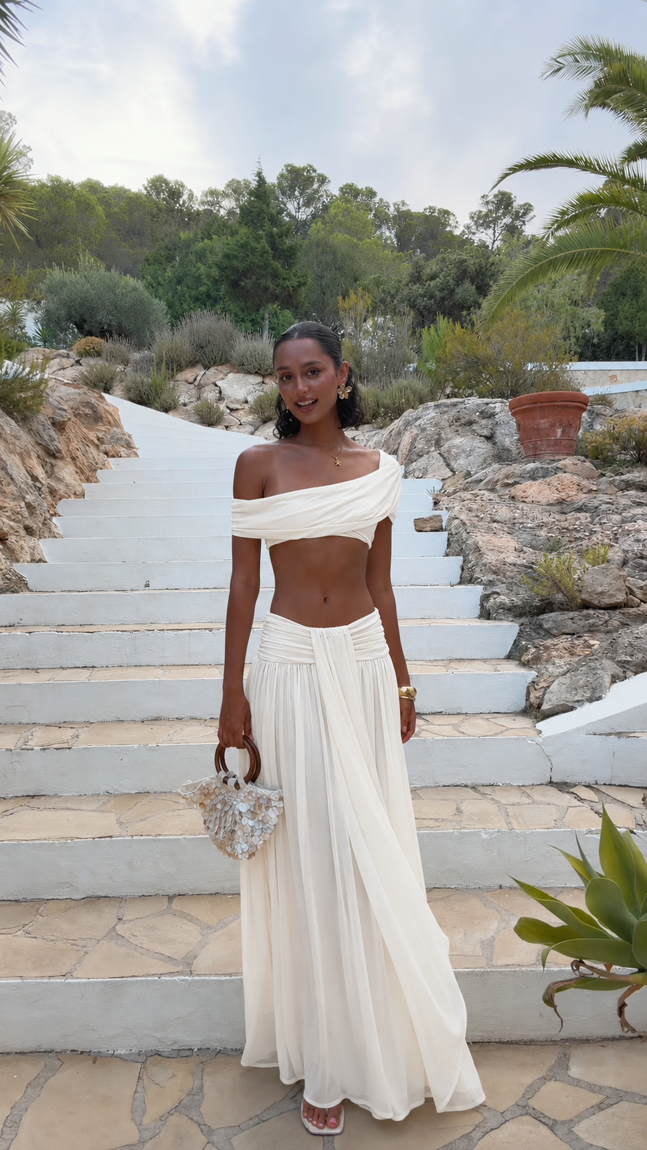Ivory off-shoulder crop top and maxi skirt set with soft gathered waistband