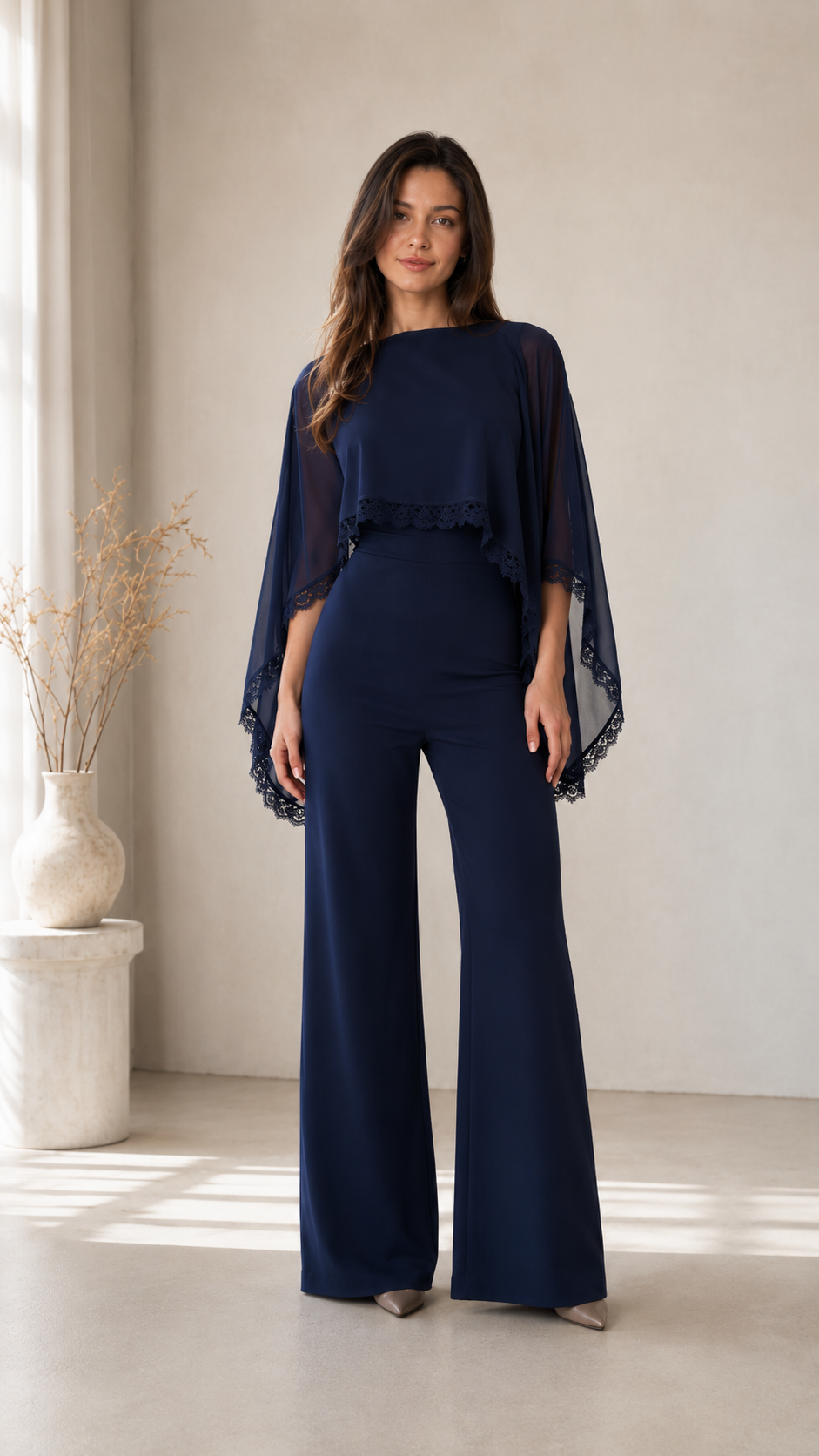 Front view of navy cape sleeve wide leg jumpsuit